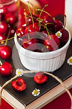 Ripe juicy sweet cherry close-up. Still life of berries and flowers. photo