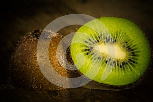 Ripe kiwi on wooden table close-up