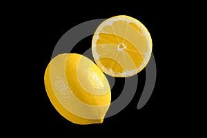 Ripe lemons isolated on a black background. Top view, close up