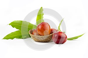 Ripe mango in basket with leaf isolated on white background