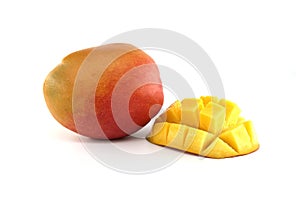 Cubed mango pieces and ripe mango fruit on white photo