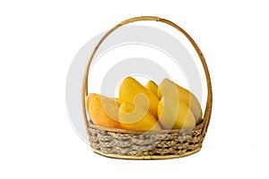 Ripe mango tropical fruit in basket isolated white background.