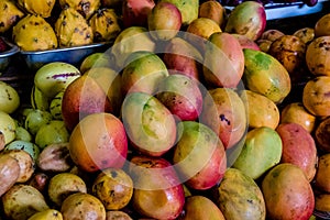 Ripe mangoes in an indoor market in Cuenca, Ecuador