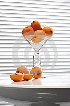 Ripe Medlars (Mespilus germanica) in cocktail glass