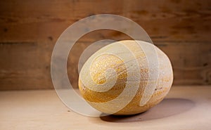 Ripe melon on a wooden background