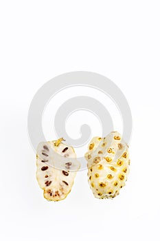 Ripe Noni Fruit - Morinda citrifolia. White background