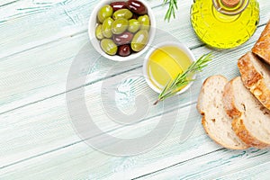 Ripe olives, olive oil and ciabatta bread