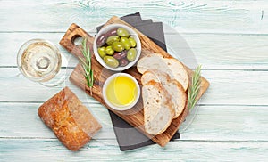 Ripe olives, olive oil and ciabatta bread