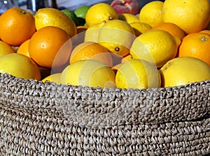 Ripe Orange and yellow Sicilian lemons in a box