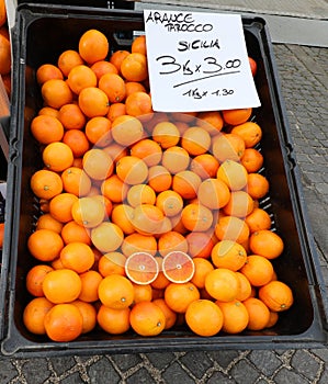 ripe oranges for sale with label and price in italian language photo