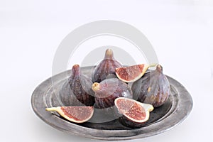 Ripe organic Figs Ceramic plate Isolated white background background Still life Copy space Autumn harvest