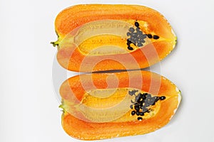 Ripe papaya half cut on white