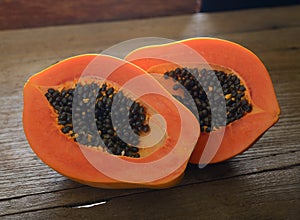 Ripe papaya on wooden background