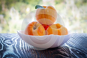 Ripe peaches on a plate