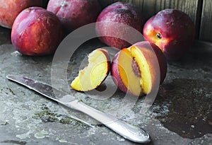 Ripe peaches on a rustic metal background