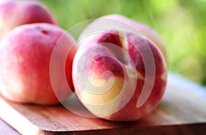 ripe peaches on wooden table