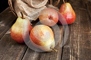 Ripe pears on wooden table