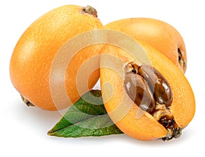 Ripe perfect loquats fruits with green leaves isolated on white background