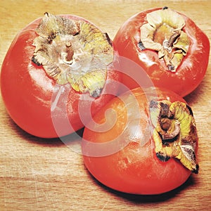 Ripe persimons on the table