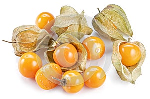 Ripe physalis or golden berry fruits in calyx isolated on white background photo