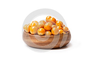 Ripe physalis in wooden bowl on white background