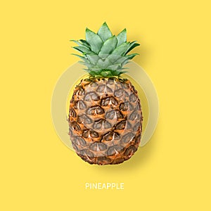 Ripe pineapple isolated on yellow background