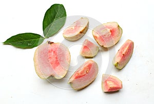 ripe pink guava ,red guava (psidium guajava) fruit with green leaf and half slices,whole isolated on white backdrop
