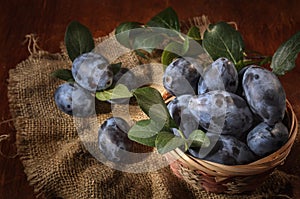 Ripe plum in a basket