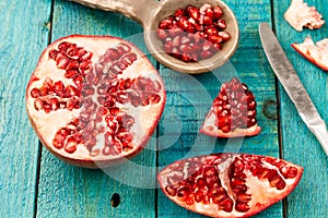 Ripe pomegranate fruit on wooden vintage background. Healthy vegetarian food.