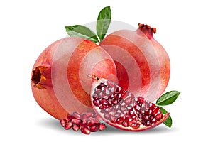 A ripe pomegranate with seeds and leaves. Background with pomegranate fruit. Pomegranate fruit on a whitebackground.