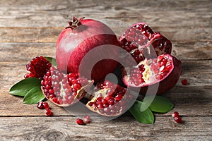 Ripe pomegranates and leaves photo