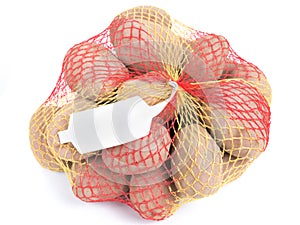 Ripe potatoes in string bag