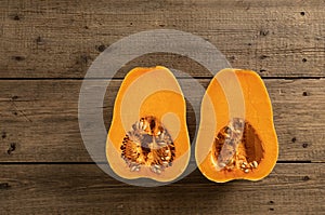 Ripe pumpkin fruits on wooden background