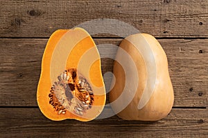 Ripe pumpkin fruits on wooden background