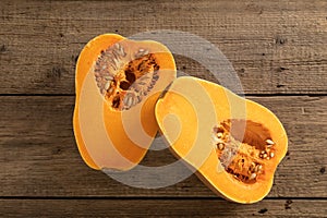 Ripe pumpkin fruits on wooden background