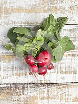 Ripe radish bunch on a wooden table