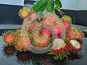 Ripe rambutan is red