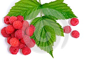 Ripe raspberry berry on a white background with a green leaf