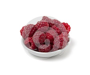 Ripe raspberry on a saucer