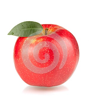 A ripe red apple with green leaf