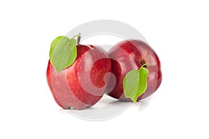 Ripe red apple with a leaf