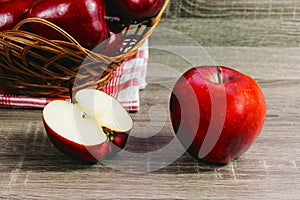 Ripe red apples full of vitamins on wooden table