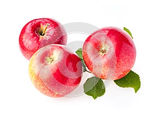 Ripe red apples with leaves isolate on white background