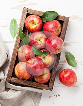 Red apples in wooden box