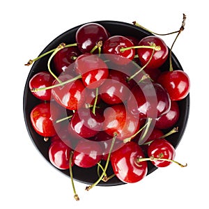 Ripe red cherries. Bowl full of sweet cherries on isolated white background. File contains clipping path