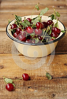 Ripe red cherries in a bowl macro