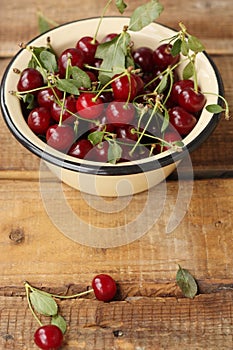 Ripe red cherries in a bowl macro