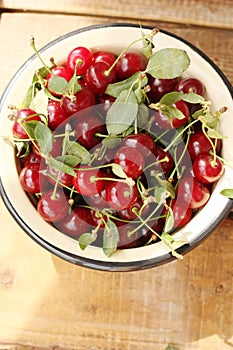 Ripe red cherries in a bowl macro