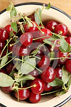 Ripe red cherries in a bowl macro