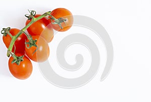 Ripe red cherry tomatoes on a branch, isolated on a white background, top view